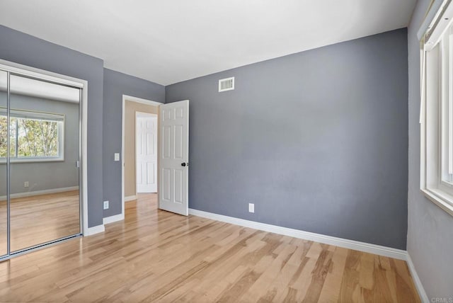 3442 Celinda Dr, Carlsbad, CA 92008 - unfurnished bedroom with light wood-type flooring and a closet