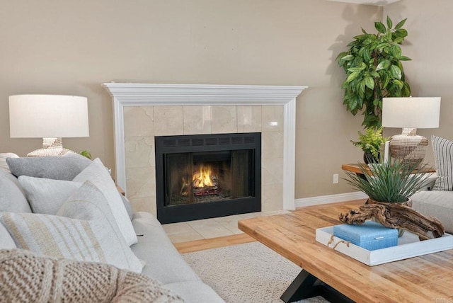 3442 Celinda Dr, Carlsbad, CA 92008 - living room featuring a tiled fireplace and wood finished floors