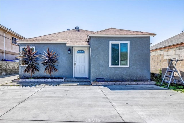 1612 W 226th St, Torrance, CA 90501 - view of front of home with stucco siding, a patio, and a shingled roof
