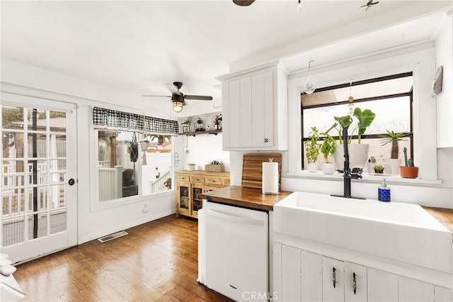 206 S Wisconsin St, Fallbrook, CA 92028 - kitchen with white dishwasher, a ceiling fan, a sink, wood counters, and healthy amount of natural light