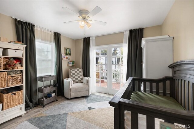 206 S Wisconsin St, Fallbrook, CA 92028 - bedroom with multiple windows, wood finished floors, access to exterior, and a ceiling fan