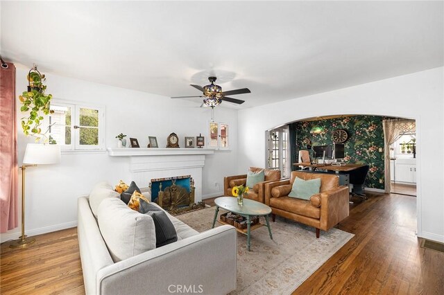 206 S Wisconsin St, Fallbrook, CA 92028 - living room with baseboards, wood finished floors, a fireplace with flush hearth, and a ceiling fan
