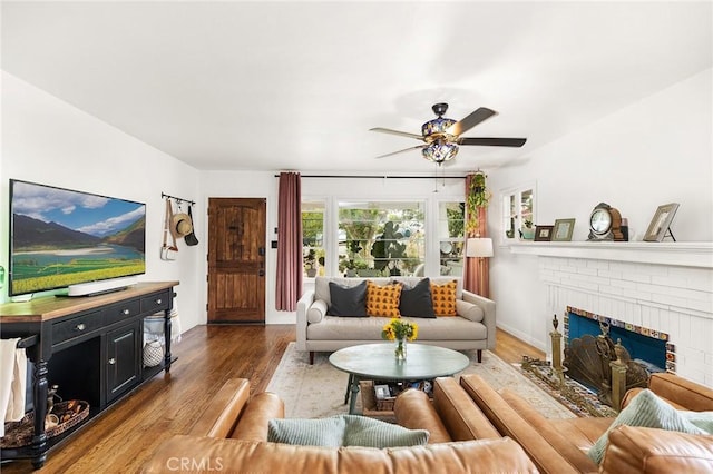 206 S Wisconsin St, Fallbrook, CA 92028 - living room with a ceiling fan, wood finished floors, a brick fireplace, and baseboards