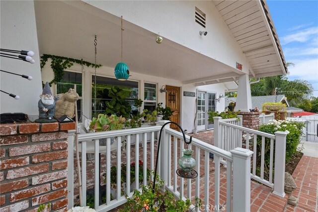 206 S Wisconsin St, Fallbrook, CA 92028 - doorway to property with a porch and stucco siding