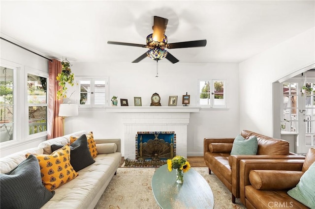 206 S Wisconsin St, Fallbrook, CA 92028 - living room featuring ceiling fan, a brick fireplace, and wood finished floors
