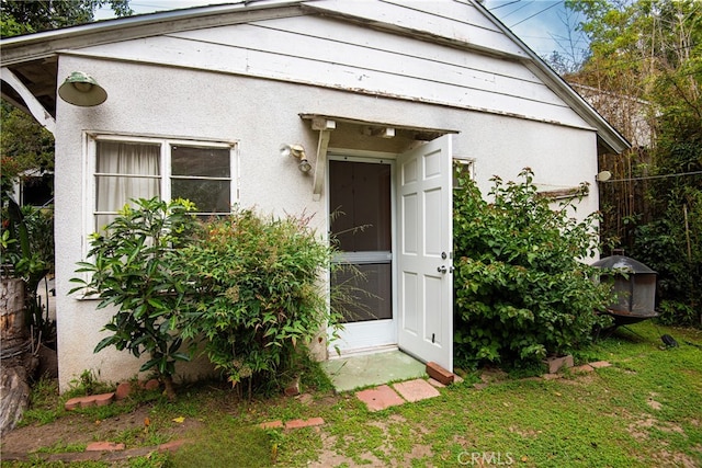 1731 Roscomare Rd, Los Angeles, CA 90077 - view of front of property featuring stucco siding and a front lawn