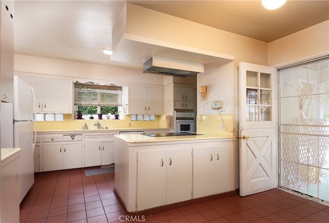 1731 Roscomare Rd, Los Angeles, CA 90077 - kitchen featuring white appliances, white cabinets, light countertops, and a sink