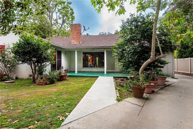 1731 Roscomare Rd, Los Angeles, CA 90077 - back of property with a chimney, a patio, and a shingled roof