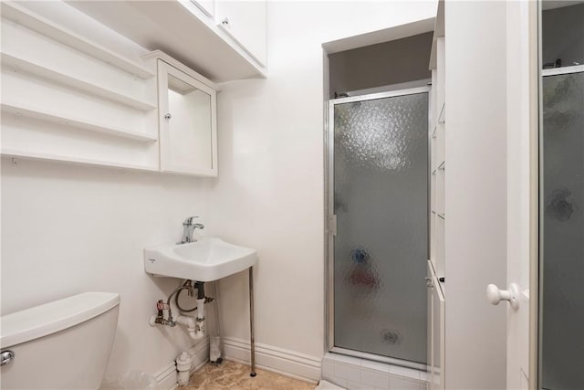 1731 Roscomare Rd, Los Angeles, CA 90077 - bathroom with toilet, a stall shower, and baseboards