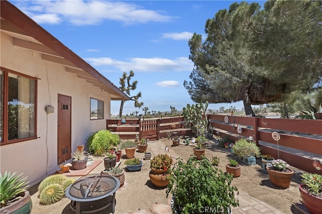 56287 Navajo Trl, Yucca Valley, CA 92284 - fenced backyard with a patio area