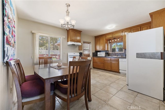 56287 Navajo Trl, Yucca Valley, CA 92284 - dining area with a chandelier and light tile patterned floors