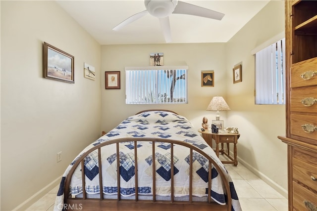 56287 Navajo Trl, Yucca Valley, CA 92284 - tiled bedroom with baseboards and ceiling fan