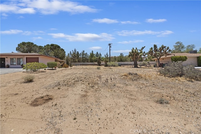56287 Navajo Trl, Yucca Valley, CA 92284 - view of yard with a garage