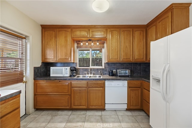 56287 Navajo Trl, Yucca Valley, CA 92284 - kitchen with white appliances, a sink, tasteful backsplash, and brown cabinetry