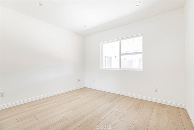 11127 Monogram Ave, Granada Hills, CA 91344 - unfurnished room featuring baseboards, light wood finished floors, and recessed lighting