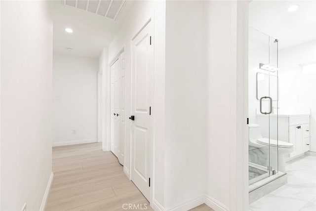 11127 Monogram Ave, Granada Hills, CA 91344 - corridor with baseboards, recessed lighting, and light wood finished floors