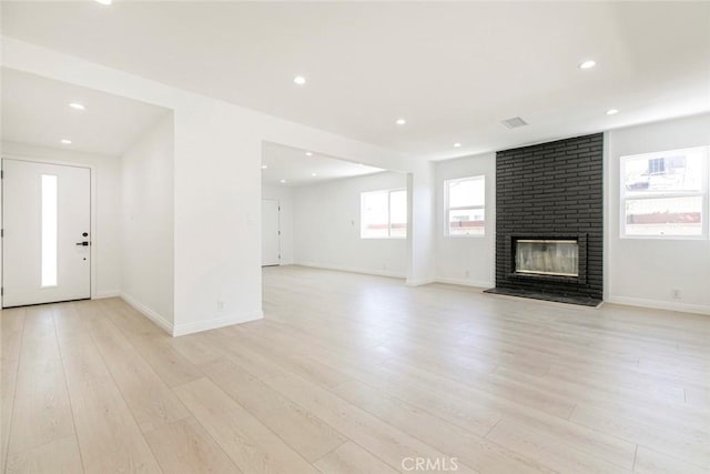 11127 Monogram Ave, Granada Hills, CA 91344 - unfurnished living room featuring a fireplace, light wood-style flooring, recessed lighting, and baseboards