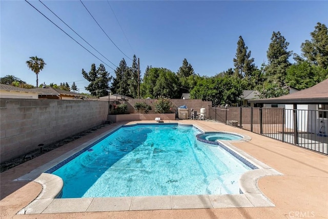 11127 Monogram Ave, Granada Hills, CA 91344 - view of pool with a fenced backyard, a pool with connected hot tub, and a patio area