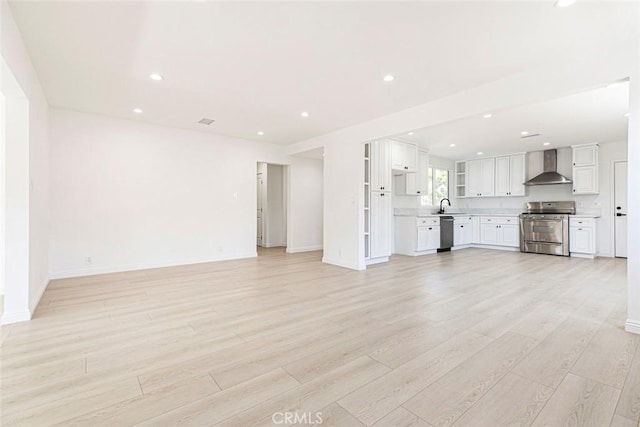 11127 Monogram Ave, Granada Hills, CA 91344 - unfurnished living room featuring a sink, light wood finished floors, recessed lighting, and baseboards