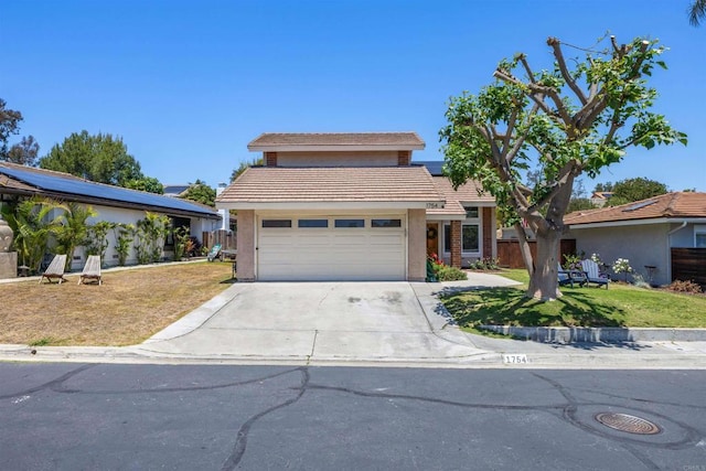 1754 Hill Top Ln, Encinitas, CA 92024 - traditional-style home with a tile roof, concrete driveway, stucco siding, and a garage