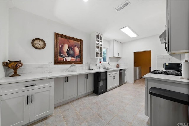 13808 Pomerado Rd, Poway, CA 92064 - kitchen with a sink, backsplash, washing machine and dryer, and dishwashing machine