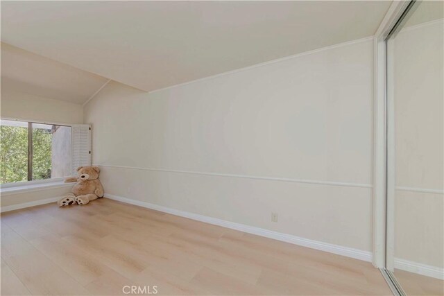 28012 Ridgeforest Ct, Rancho Palos Verdes, CA 90275 - spare room with light wood finished floors, baseboards, and lofted ceiling