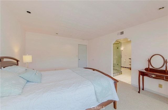 28012 Ridgeforest Ct, Rancho Palos Verdes, CA 90275 - bedroom featuring arched walkways, light carpet, and ensuite bath