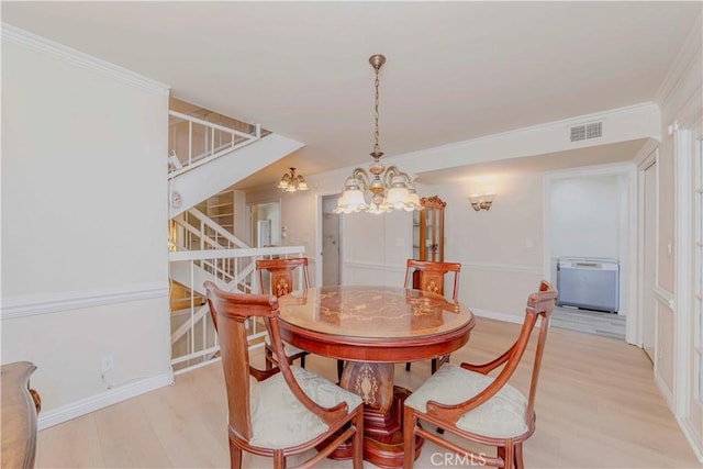 28012 Ridgeforest Ct, Rancho Palos Verdes, CA 90275 - dining room with stairs, a chandelier, light wood-type flooring, crown molding, and heating unit