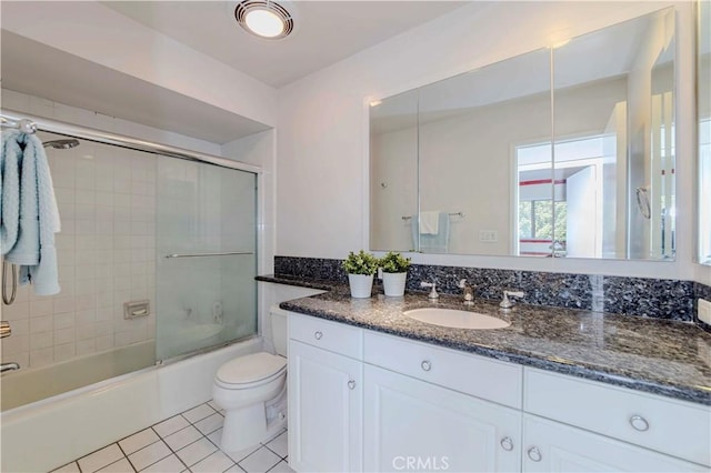 28012 Ridgeforest Ct, Rancho Palos Verdes, CA 90275 - bathroom with vanity, toilet, tile patterned floors, and combined bath / shower with glass door