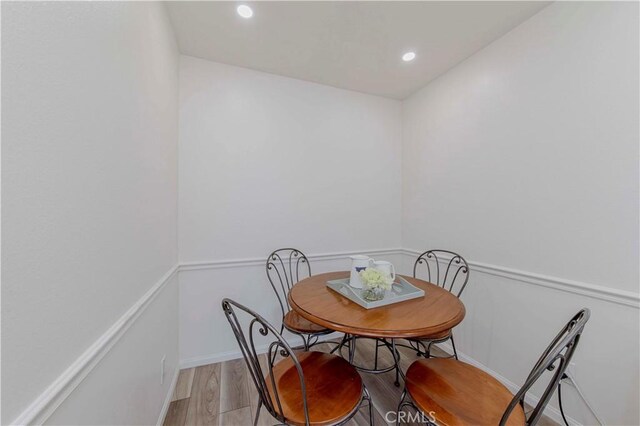 28012 Ridgeforest Ct, Rancho Palos Verdes, CA 90275 - dining room with light wood-type flooring, recessed lighting, and baseboards