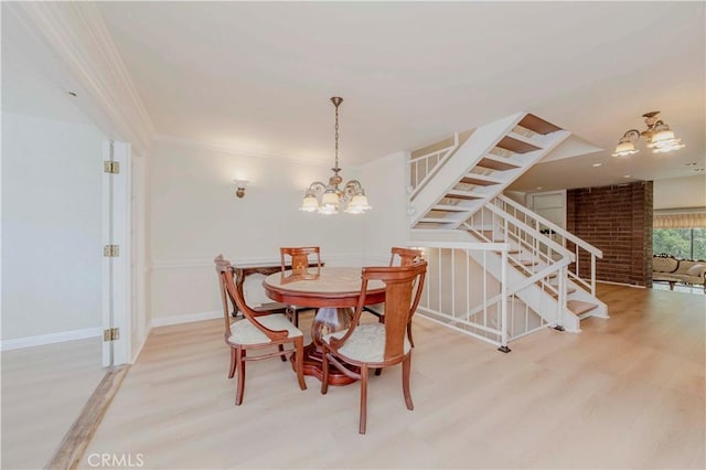 28012 Ridgeforest Ct, Rancho Palos Verdes, CA 90275 - dining room featuring a chandelier, stairway, light wood finished floors, and ornamental molding