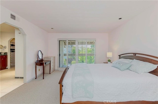 28012 Ridgeforest Ct, Rancho Palos Verdes, CA 90275 - bedroom with arched walkways, light tile patterned flooring, and light colored carpet