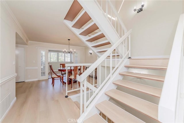 28012 Ridgeforest Ct, Rancho Palos Verdes, CA 90275 - stairs with crown molding, wood finished floors, and a chandelier