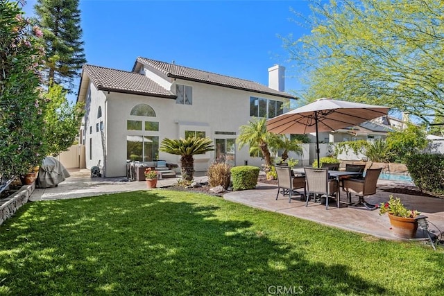 32147 Corte Florecita, Temecula, CA 92592 - rear view of property featuring a patio area, a chimney, a tiled roof, and stucco siding