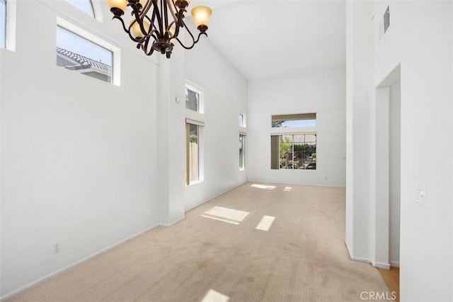 32147 Corte Florecita, Temecula, CA 92592 - unfurnished living room featuring a chandelier, carpet floors, and a high ceiling