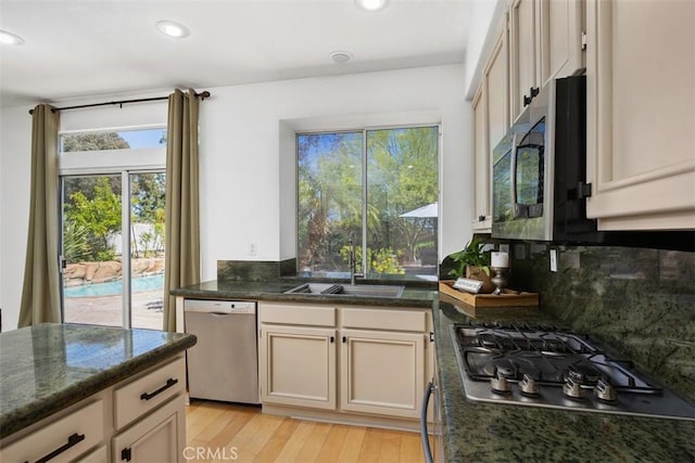 32147 Corte Florecita, Temecula, CA 92592 - kitchen with stainless steel appliances, a sink, decorative backsplash, plenty of natural light, and recessed lighting