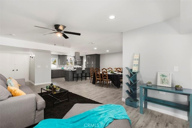25781 Interlechen Dr, Menifee, CA 92586 - living area featuring light wood-style flooring, a ceiling fan, recessed lighting, and baseboards