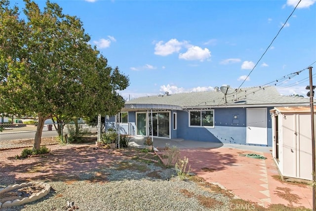 25781 Interlechen Dr, Menifee, CA 92586 - rear view of house featuring a patio area, stucco siding, and roof with shingles