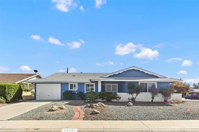 25781 Interlechen Dr, Menifee, CA 92586 - ranch-style home featuring a garage, driveway, and brick siding