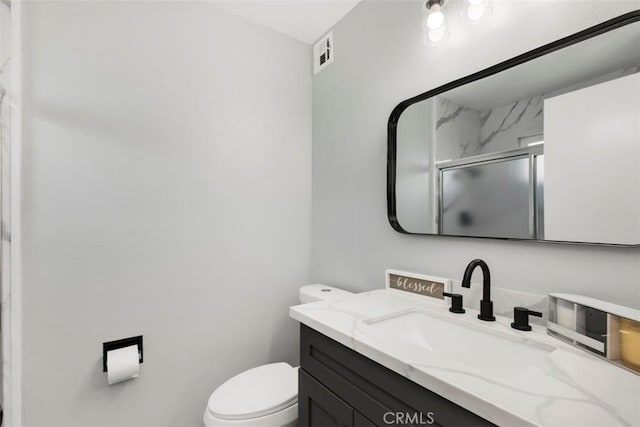 25781 Interlechen Dr, Menifee, CA 92586 - full bathroom with vanity, a shower stall, and toilet
