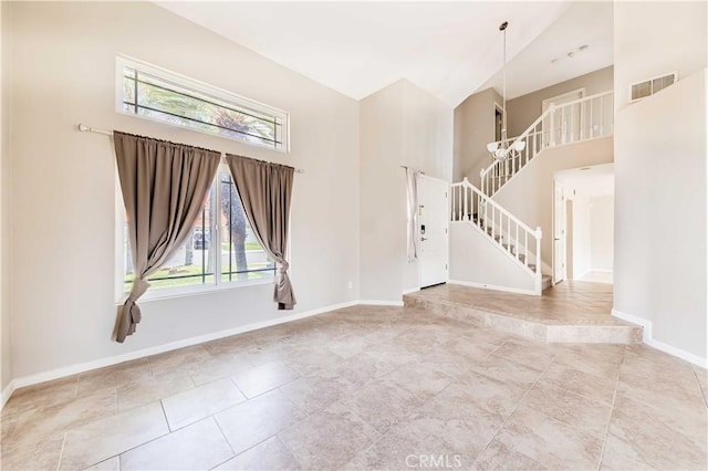 24701 New Haven Dr, Murrieta, CA 92562 - unfurnished living room featuring a high ceiling, plenty of natural light, and baseboards