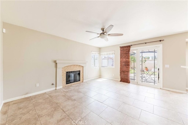 24701 New Haven Dr, Murrieta, CA 92562 - unfurnished living room with a ceiling fan, a tiled fireplace, baseboards, and light tile patterned floors