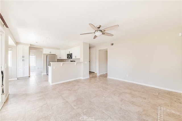 24701 New Haven Dr, Murrieta, CA 92562 - unfurnished living room featuring ceiling fan and baseboards