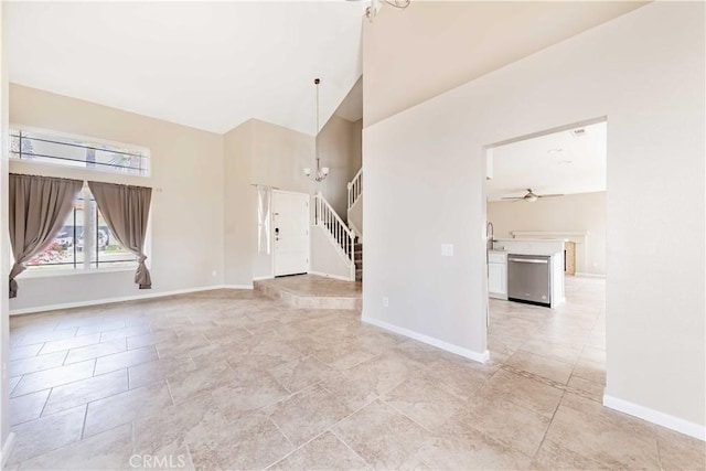24701 New Haven Dr, Murrieta, CA 92562 - unfurnished room with high vaulted ceiling, a ceiling fan, baseboards, and a chandelier