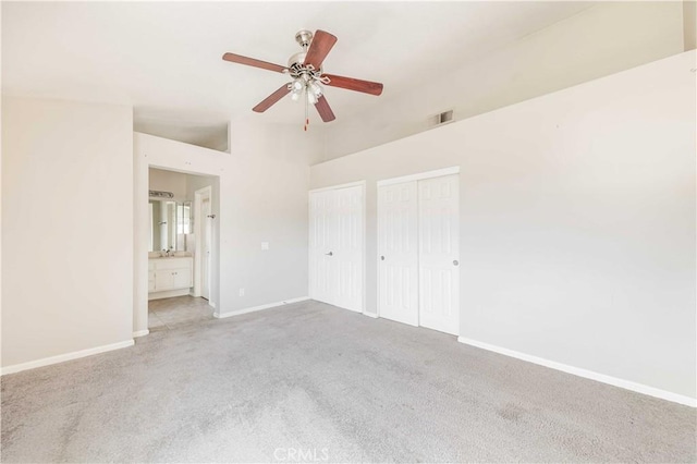 24701 New Haven Dr, Murrieta, CA 92562 - unfurnished bedroom featuring carpet, baseboards, multiple closets, ensuite bath, and a towering ceiling