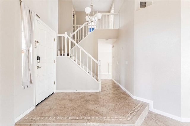 24701 New Haven Dr, Murrieta, CA 92562 - entryway with a chandelier, stairs, baseboards, and a high ceiling