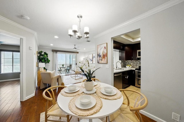 3078 Broadway Unit 210, San Diego, CA 92102 - dining space with plenty of natural light, a chandelier, light wood finished floors, baseboards, and ornamental molding