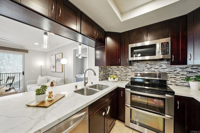 3078 Broadway Unit 210, San Diego, CA 92102 - kitchen featuring stainless steel appliances, a sink, open floor plan, decorative backsplash, and light stone countertops