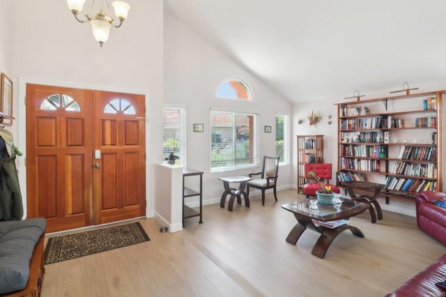 4294 Panorama Dr, La Mesa, CA 91941 - entryway with high vaulted ceiling, a chandelier, light wood-style flooring, and baseboards