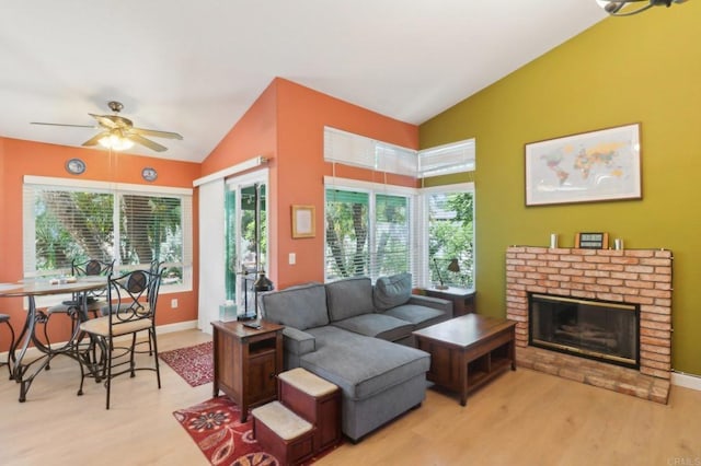 4294 Panorama Dr, La Mesa, CA 91941 - living area featuring vaulted ceiling, light wood finished floors, ceiling fan, a brick fireplace, and baseboards